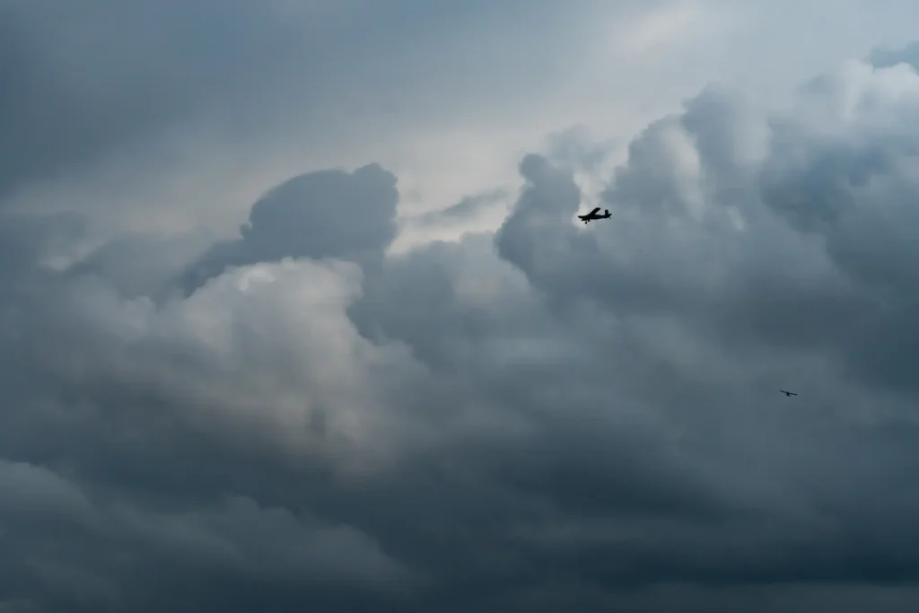 Light aircraft flying under VFR in clear weather, illustrating general aviation flight.